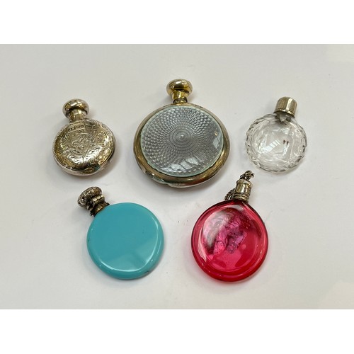 5215 - Five various scent bottles including silver with guilloche detail, together with cranberry glass exa... 