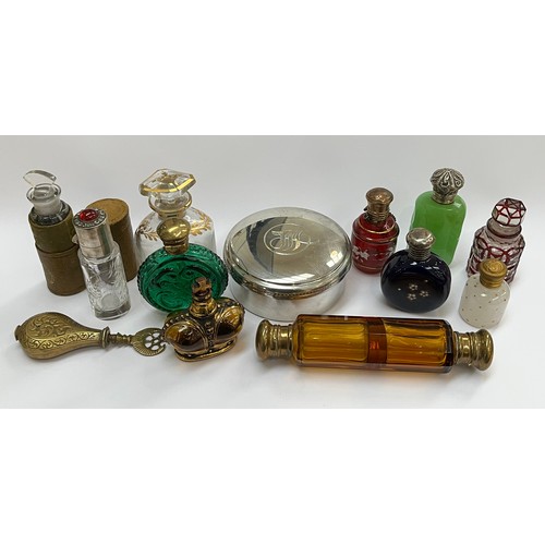 5219 - A collection of scent bottles including amber glass double-ended and gilt enriched, together with a ... 