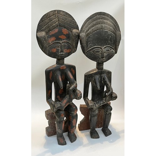 5228 - A pair of Northern Ghanaian carved wood fertility figures, standing 90cm and 92cm tall