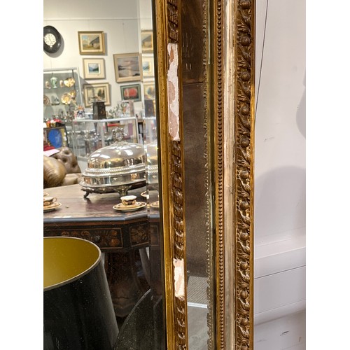 5230 - A 19th Century French gilt wood and gesso wall mirror, ribbon and basket of foliage crest, faceted b... 