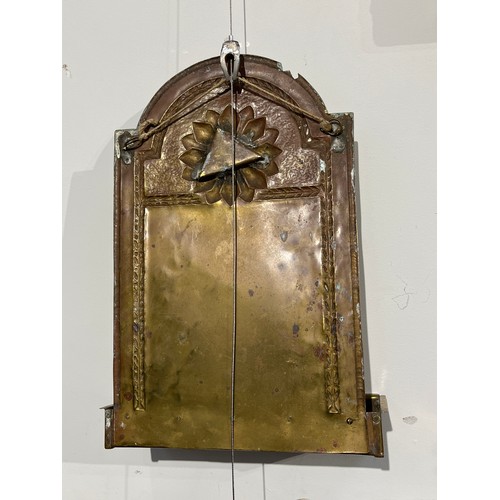 5233 - An Arts and Crafts wall hanging double candle sconce with brass arched back plate with hammered deco... 