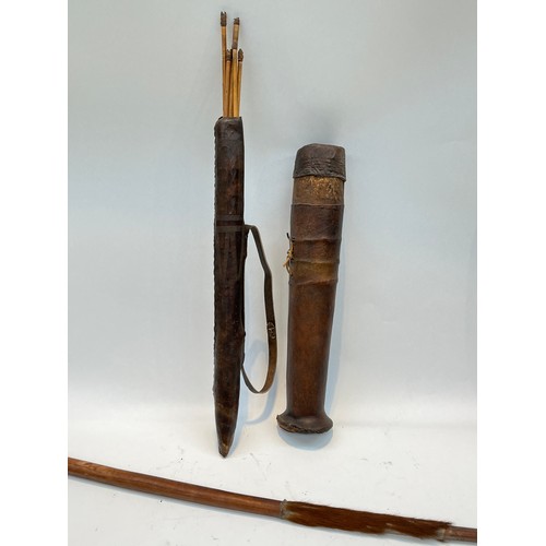 5236 - Two African quivers, one with barbed arrows a/f, together with an African tribal bow with hide grip ... 