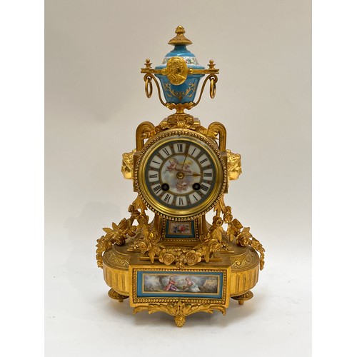 5241 - A 19th Century French ormolu and porcelain mantel clock with 8 day movement, Sevres style panels, su... 