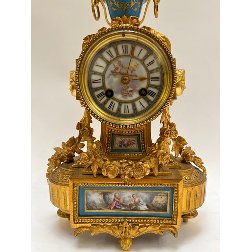 5241 - A 19th Century French ormolu and porcelain mantel clock with 8 day movement, Sevres style panels, su... 