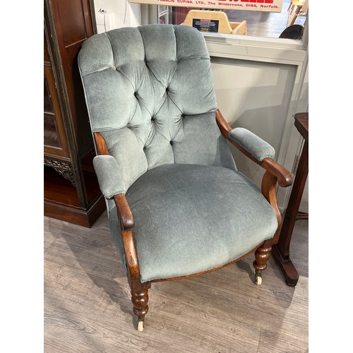 5248 - Circa 1860 a mahogany button back open armchair the scroll end arms over turned fore legs and white ... 