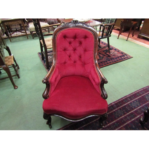 4067 - Circa 1860 a mahogany spoon back armchair the button back rest with acanthus leaf/shamrock and flora... 