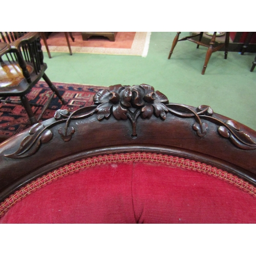 4067 - Circa 1860 a mahogany spoon back armchair the button back rest with acanthus leaf/shamrock and flora... 