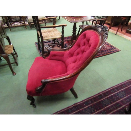 4067 - Circa 1860 a mahogany spoon back armchair the button back rest with acanthus leaf/shamrock and flora... 