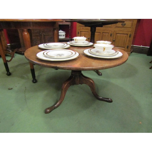 4072 - A George III oak and elm occasional table the circular top on a turned column and tripod base, 45.5c... 