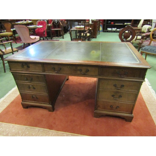 4107 - In the manner of Bevan & Funnell a George III style mahogany twin pedestal partners desk, the gilt t... 