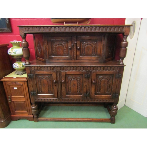 4126 - A Titchmarsh & Goodwin 17th Century revival carved and pegged oak court cupboard, the raised two doo... 