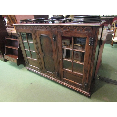 4186 - A Titchmarsh & Goodwin 17th Century revival carved and pegged oak bookcase of three doors (two panel... 