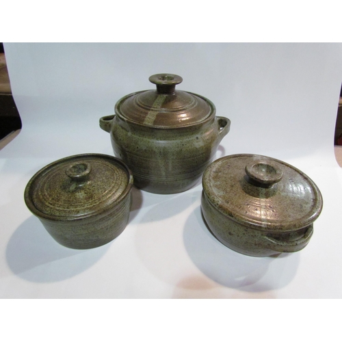 4225 - Three Studio Pottery lidded pots including Cley. Two lidded stoneware casserole dishes and two stone... 