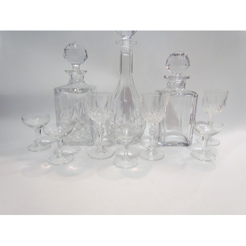 4227 - Three glass decanters and an assortment of drinking glasses