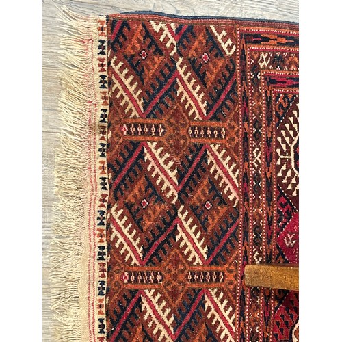 5718 - A Turkoman woven silk rug, five rows of guls, multiple borders, tasselled ends, 362cm x 240cm