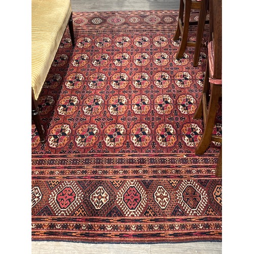 5718 - A Turkoman woven silk rug, five rows of guls, multiple borders, tasselled ends, 362cm x 240cm