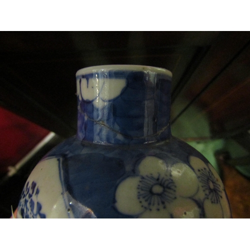 4243 - A pair of Chinese blue and white vases with covers, character marks to bases, a/f, approximately 24c... 