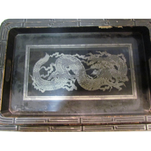 4308 - Two Oriental lacquered trays with dragon detail and a Chinese brass tray, made in China stamp