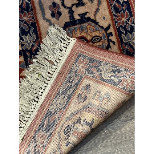 5719 - A large patterned rug in beige, dusky pinks and blues, purchased from John Lewis, 360cm x 276cm