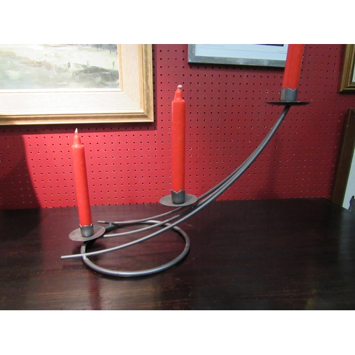 4045 - A pair of metal three branch candelabras