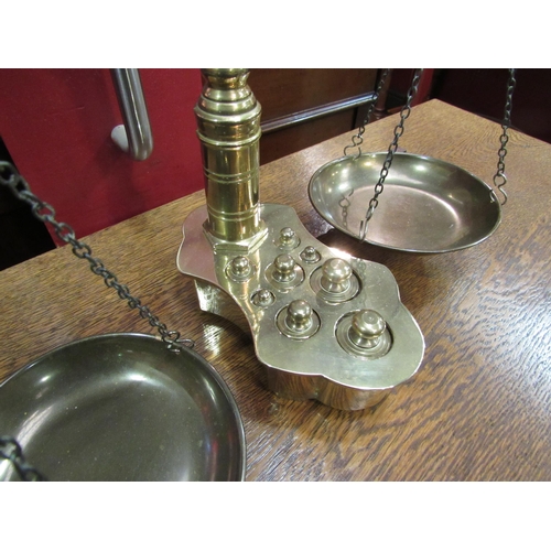 4060 - A set of brass balance scales with weights