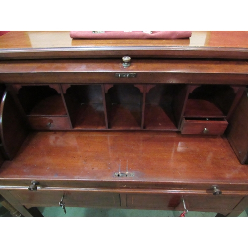 4076 - An Edwardian crossbanded mahogany cylinder bureau the fitted interior with brushing slide writing ta... 