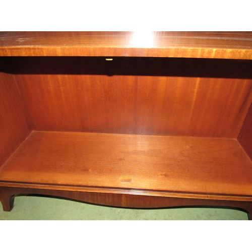 4083 - A Bevan Funnell Georgian style mahogany waterfall bookshelf, the two door cupboard with key over out... 