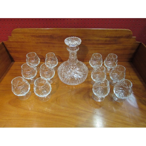 4094 - A crystal glass ship's decanter and twelve small crystal glass brandy balloons    (R) £25