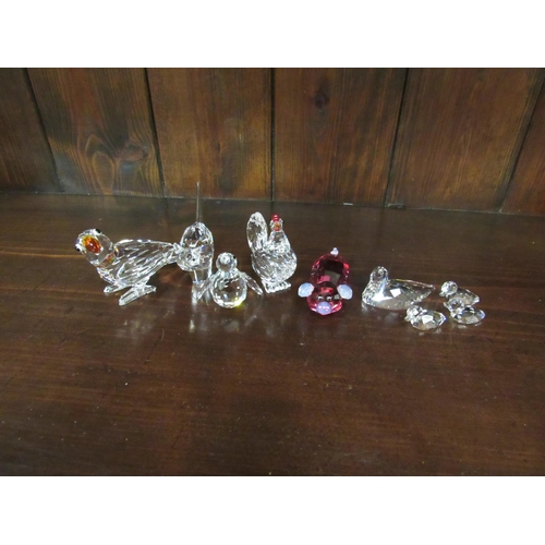 4120 - A collection of Swarovski crystal animals in original boxes: hen, set of four ducks, parrot with col... 