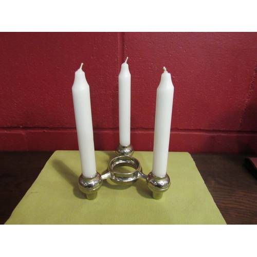 4136 - A modernist chromed candelabrum with candles    (R) £0