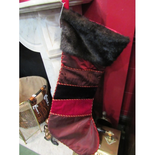 4144 - A pair of large Harrods Christmas stockings with faux fur trim and front pockets, 82cm high   (R) £2... 