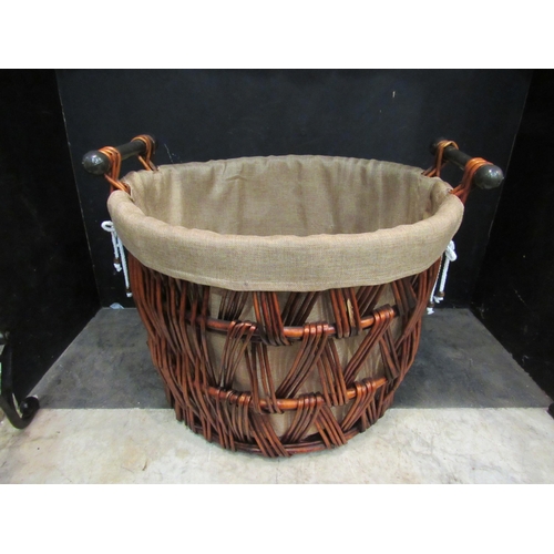 4147 - A twin metal handle log basket with hessian lining, 45cm high   (R) £30