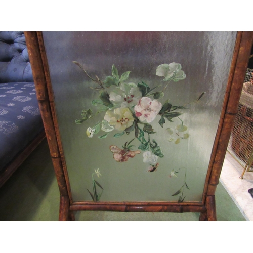 4155 - Circa 1900 a bamboo fire screen with frosted glass panel and hand painted floral decoration, 91cm hi... 