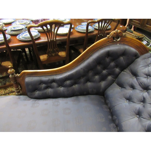 4156 - A Victorian walnut chaise longue, buttoned rich blue upholstery, on turned supports to castors, 96cm... 