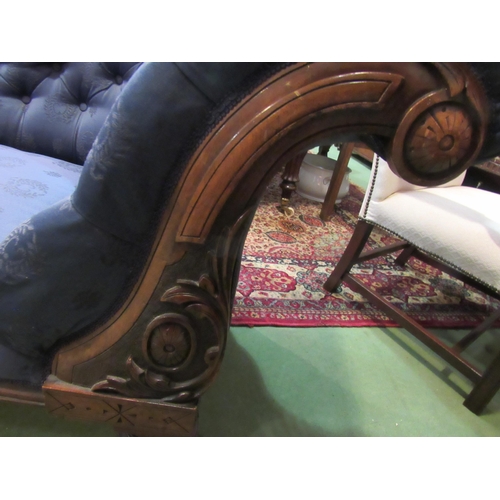 4156 - A Victorian walnut chaise longue, buttoned rich blue upholstery, on turned supports to castors, 96cm... 