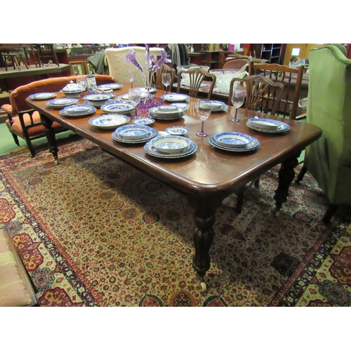 4161 - A Victorian mahogany extending dining table, two extra leaves, melon fluted legs to ceramic castors,... 