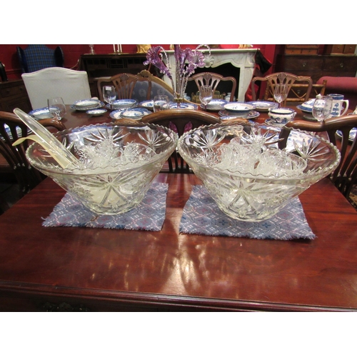 4168 - A pair of large moulded glass punch bowls with glasses and plastic ladles    (E) £15-25