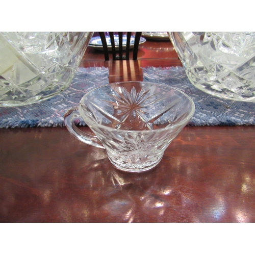 4168 - A pair of large moulded glass punch bowls with glasses and plastic ladles    (E) £15-25