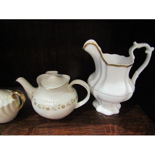 4191 - A selection of mostly Victorian cream and gilt tea pots and milk jugs including Royal Doulton and Bo... 