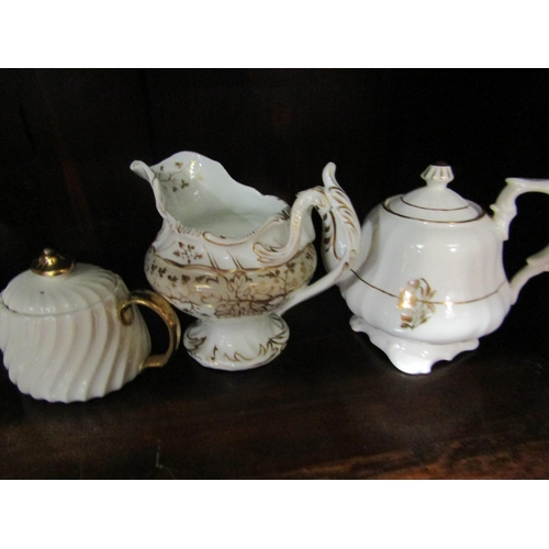 4191 - A selection of mostly Victorian cream and gilt tea pots and milk jugs including Royal Doulton and Bo... 