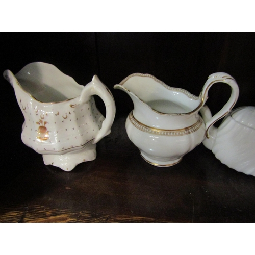 4191 - A selection of mostly Victorian cream and gilt tea pots and milk jugs including Royal Doulton and Bo... 