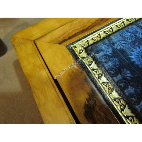 4197 - A walnut writing slope with mother-of-pearl inlay, some inlay missing, blue felt interior a/f