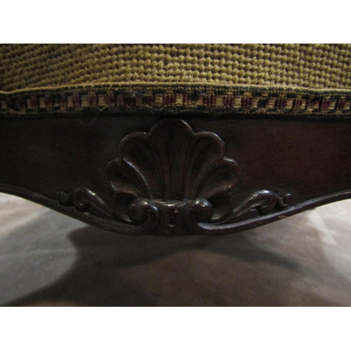 4201 - A 19th Century walnut serpentine side shaped stool the floral petit point upholstered seat over a ca... 