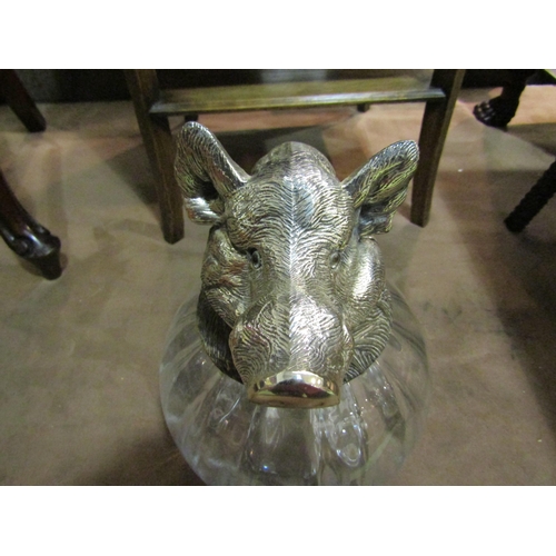 4214 - A bulbous fluted glass jug surmounted by a silver plated boar's head with glass eyes, 28cm high