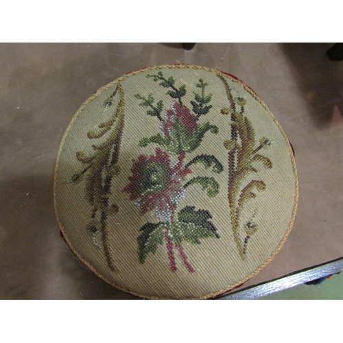 4218 - Circa 1850 a circular footstool with beadwork seat on gilt bronze eagle claw feet holding a white ce... 