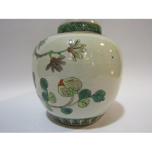 4251 - A Famille vert ginger jar with cover, scenes of birds among foliage, approximately 20cm high