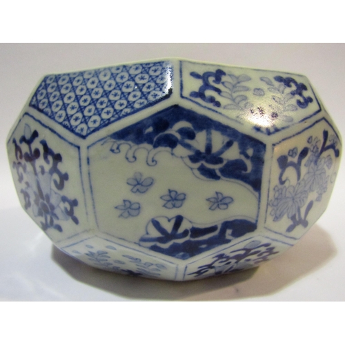 4270 - An Oriental blue and white bowl with facetted body, foliate design panels, scene of bird and dragon ... 