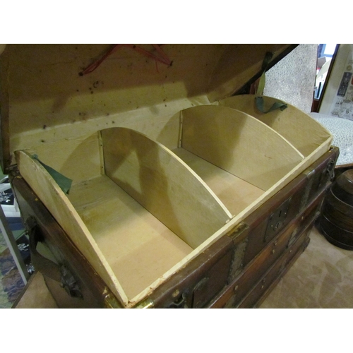 4006 - A Victorian dome top chest on castors with fitted internal compartment shelf, with key, 56cm high, 7... 