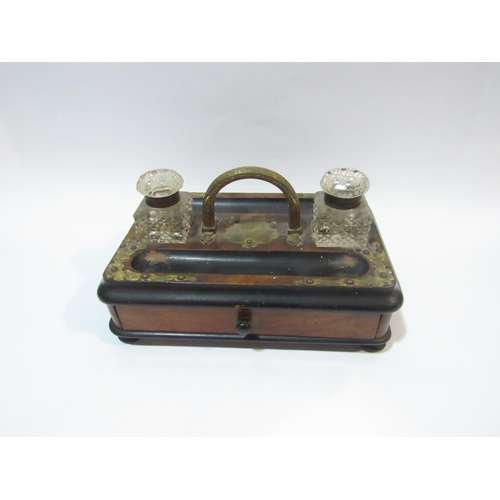 4104 - A mid-late Victorian brass-mounted portable desk stand with two glass inkwells and drawer to base. D... 