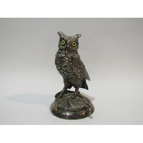 4106 - A silver-plated owl inkwell with glass eyes and ceramic liner, 18cm high. A/f Left side section of p... 